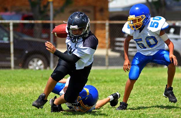 Pressure Mounts to Separate Kids and Football